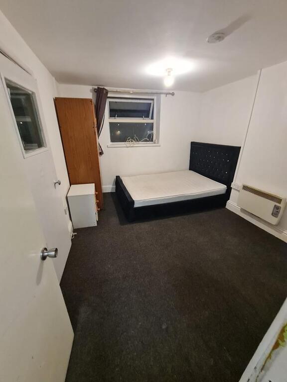 Simple, well-presented bedroom featuring a doub...