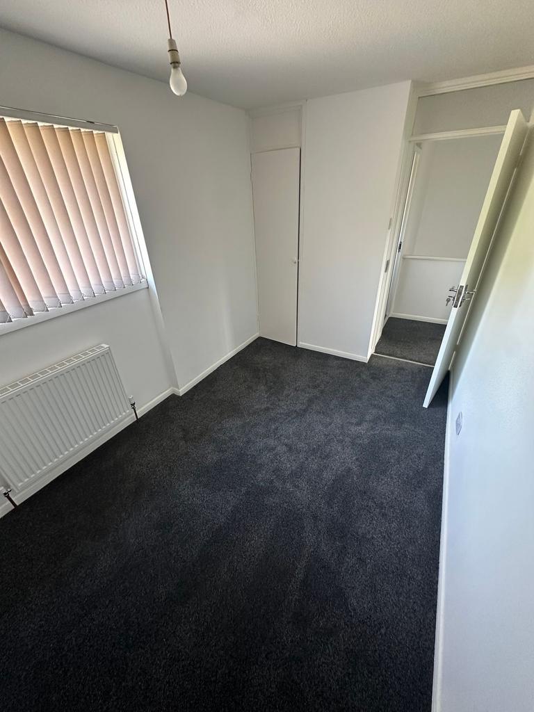 A neat and well-maintained small room with clea...