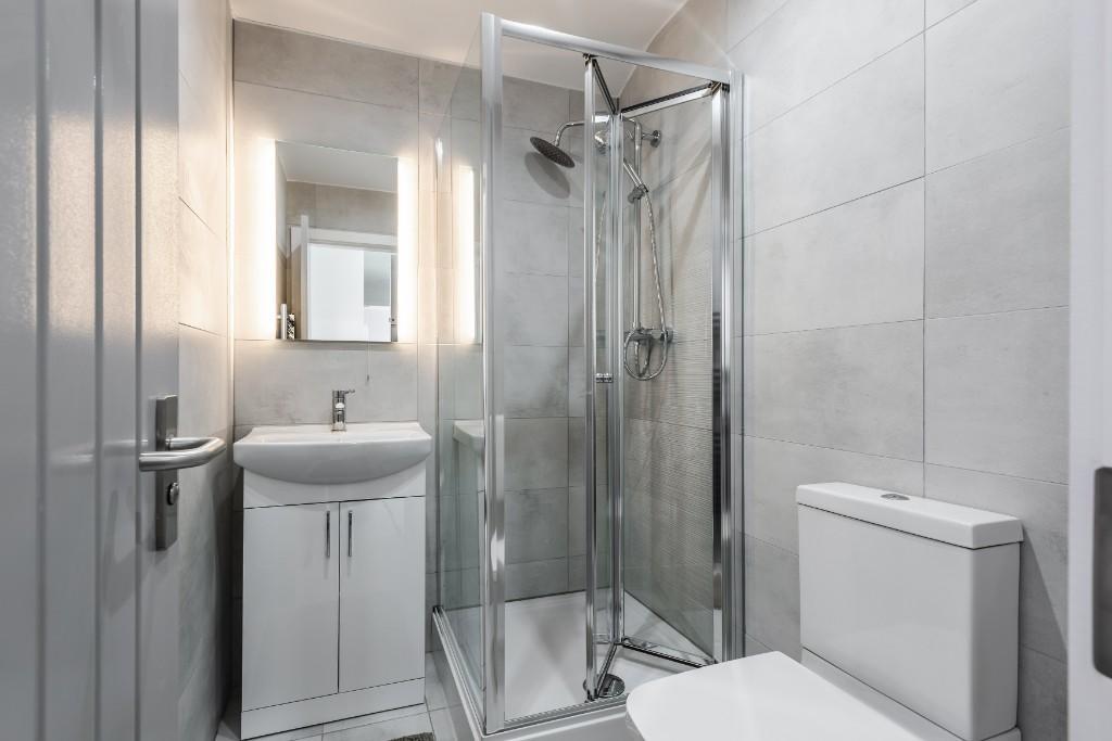 A modern, well-maintained bathroom with a spaci...