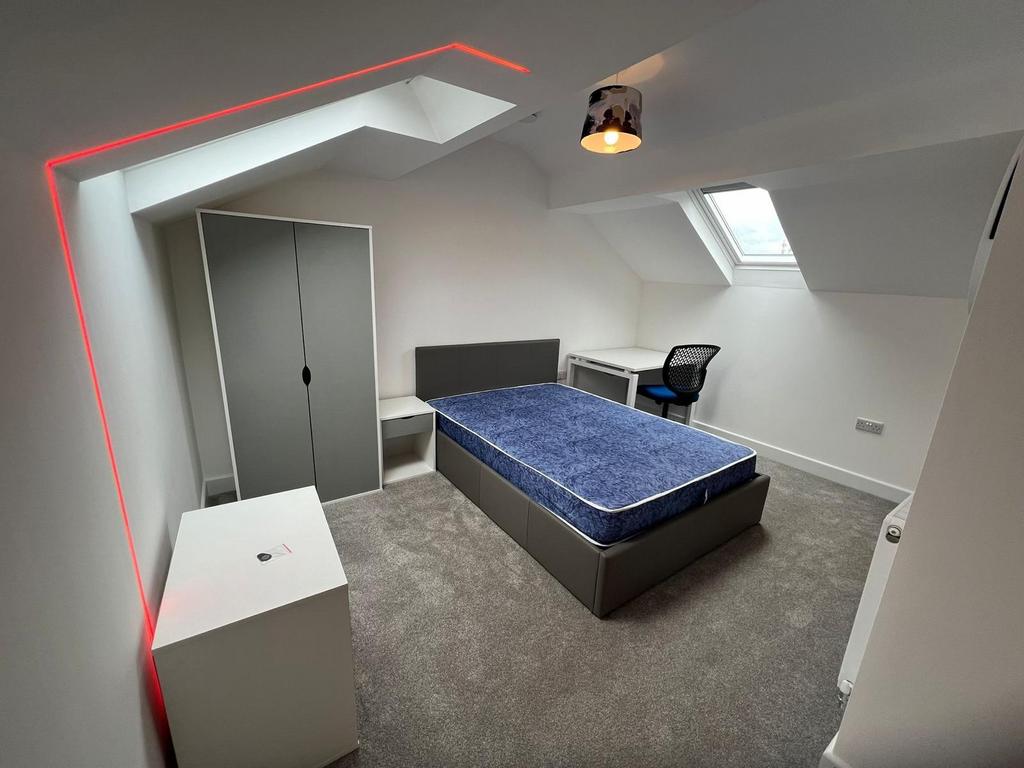 Bright, newly refurbished attic bedroom with a ...