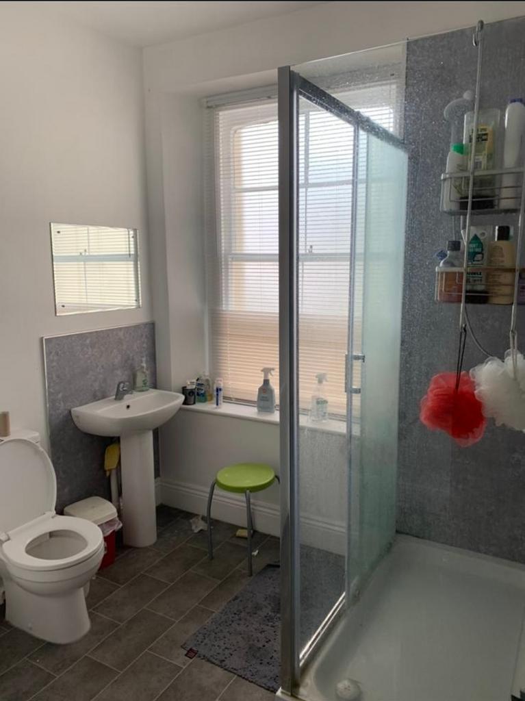 A bright and clean bathroom featuring a modern ...