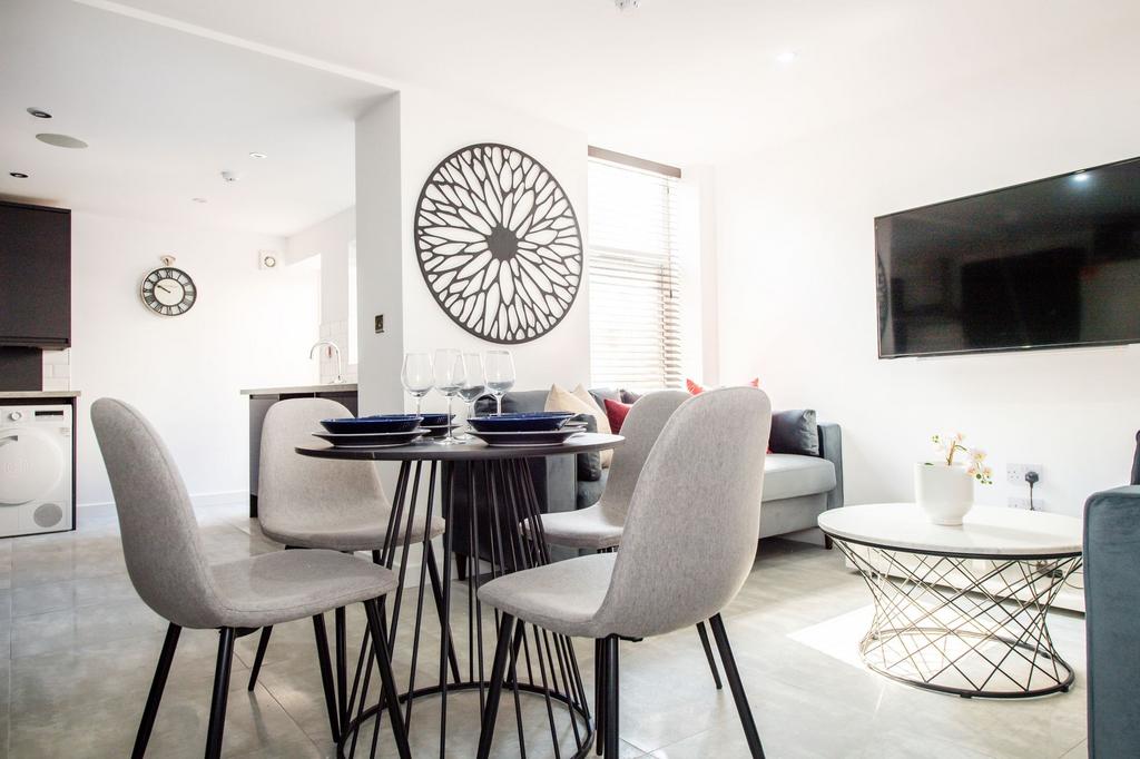 Bright and modern living room with ample natura...