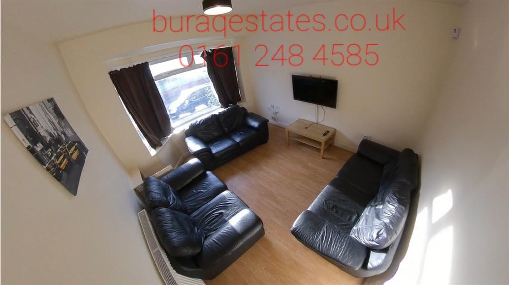 Bright, well-kept living room with three comfor...