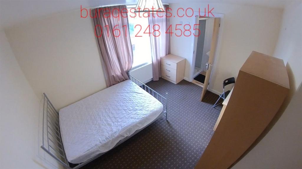 Bright bedroom with a double bed, full-length w...