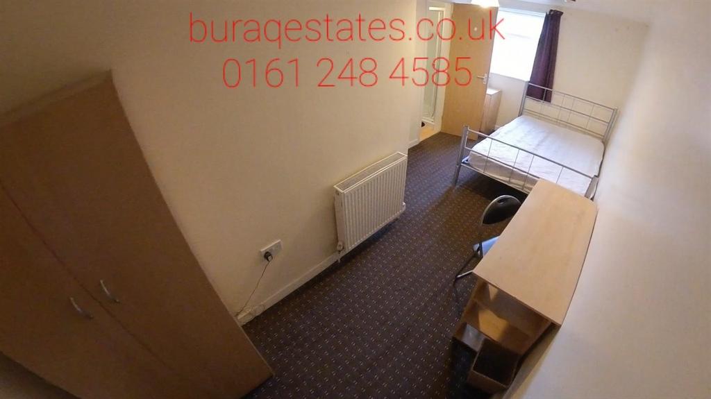 Bright, simply furnished single bedroom with a ...