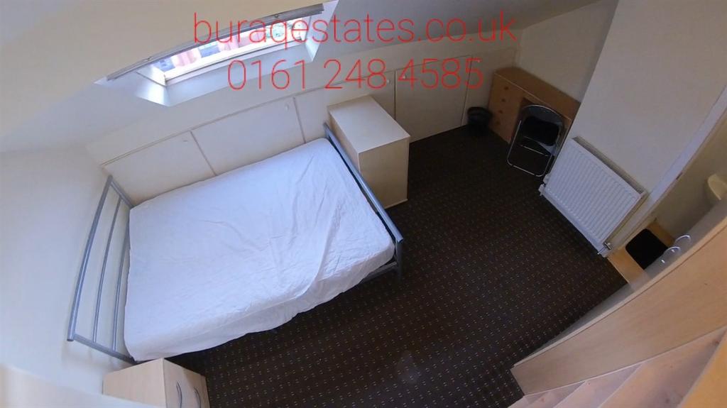 Neat single bedroom with a compact metal-frame ...