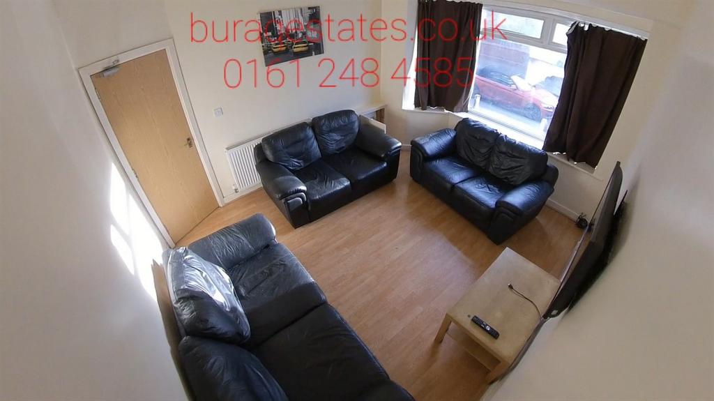 Bright furnished living room with three leather...