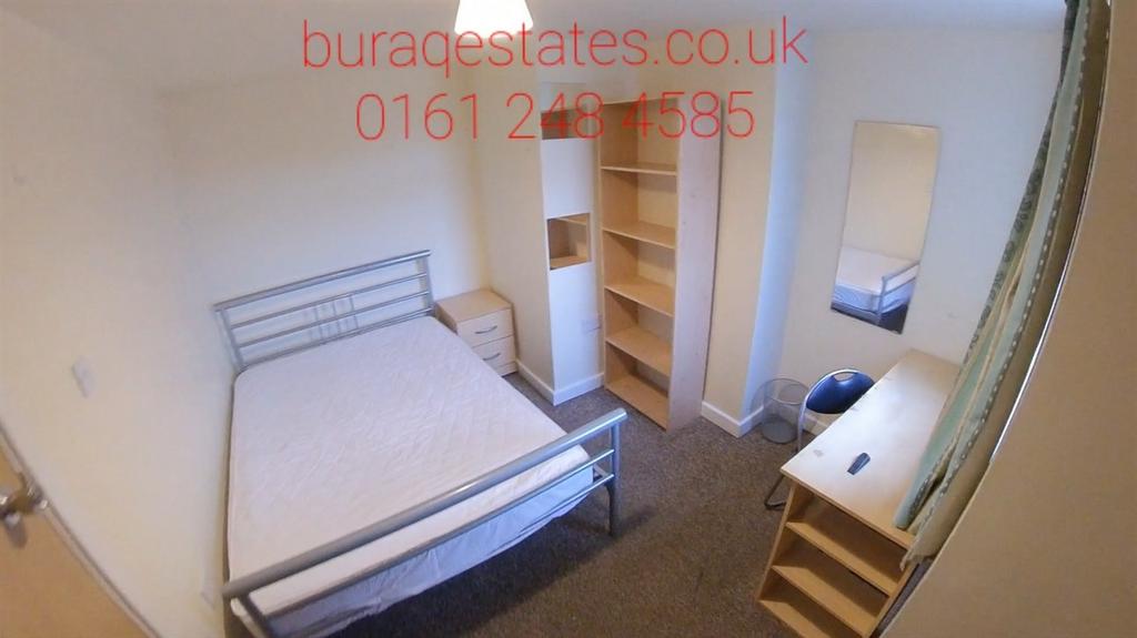 Bright, simply furnished bedroom with a single ...