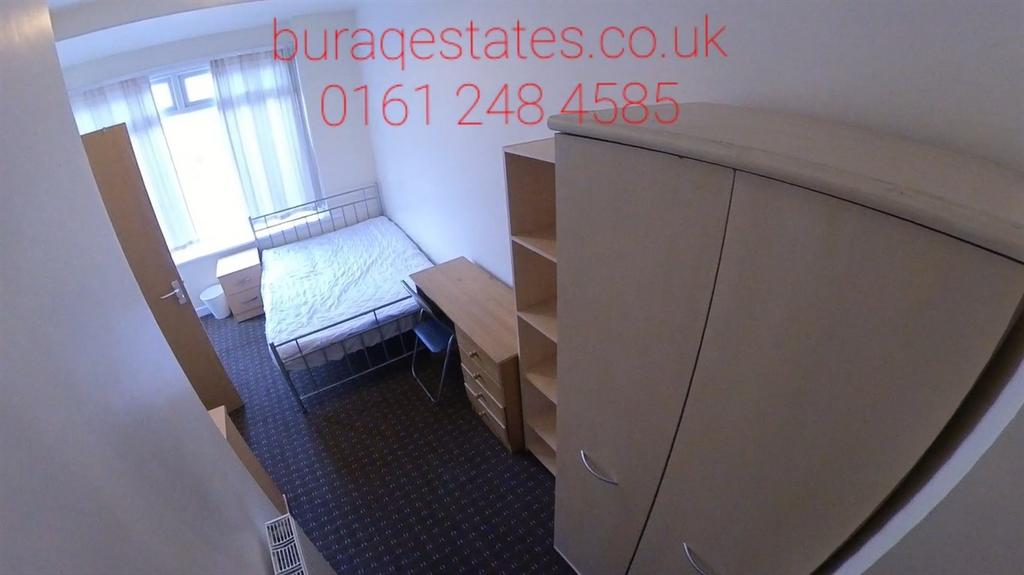 Bright, simply furnished bedroom with a window ...