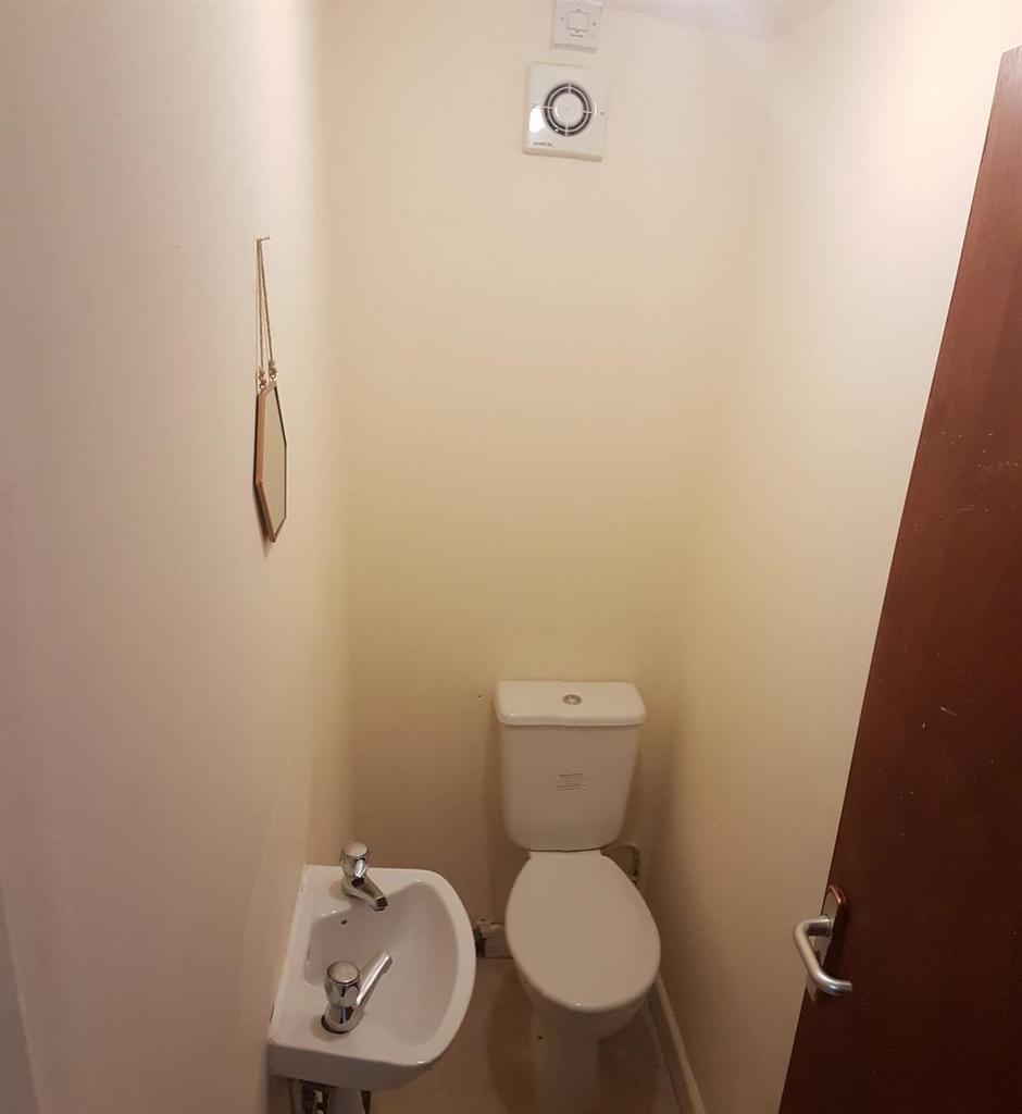 Neat, compact WC with a close-coupled toilet an...