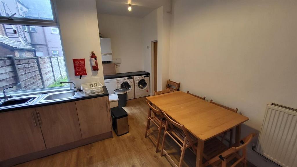 Bright, practical kitchenette with wood-effect ...