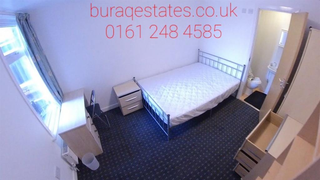 Bright single bedroom with a metal-framed bed, ...