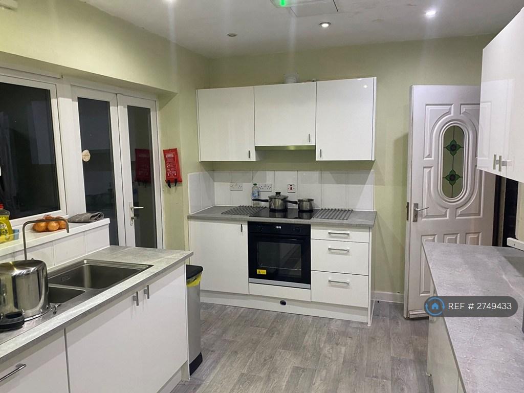 Kitchen Towards Oven And Front Door