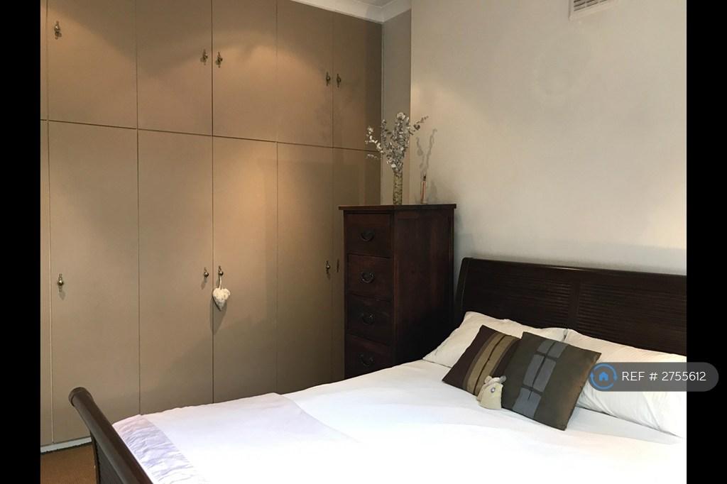 Large Built-In Wardrobe In Bedroom