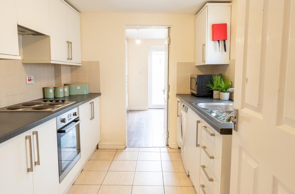 Bright and modern kitchen featuring ample stora...