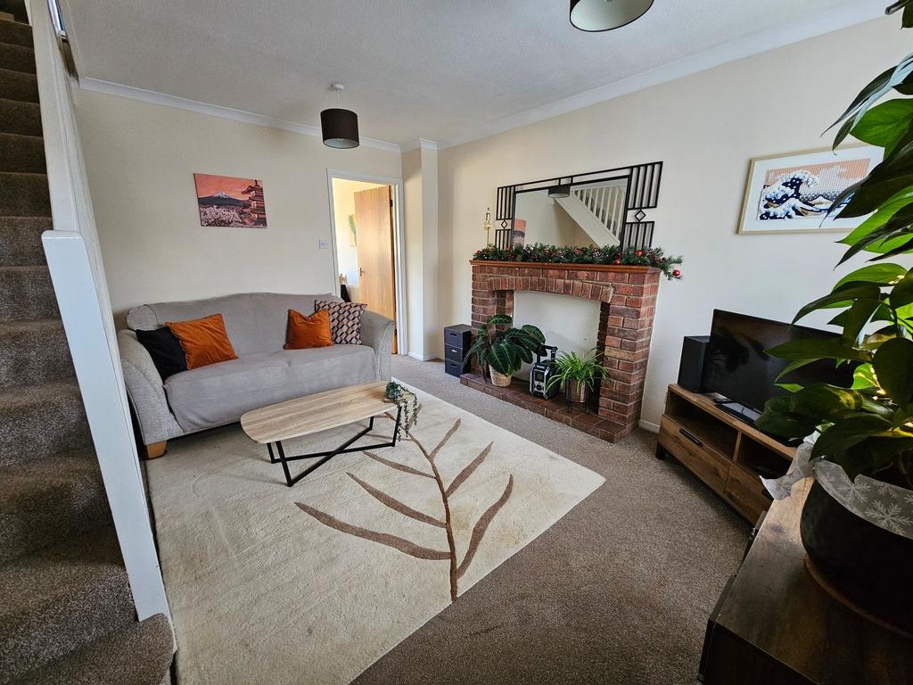 Bright, cozy living room with a comfy sofa, dec...