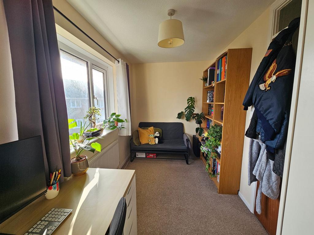 Bright, well-organised study room with a desk b...