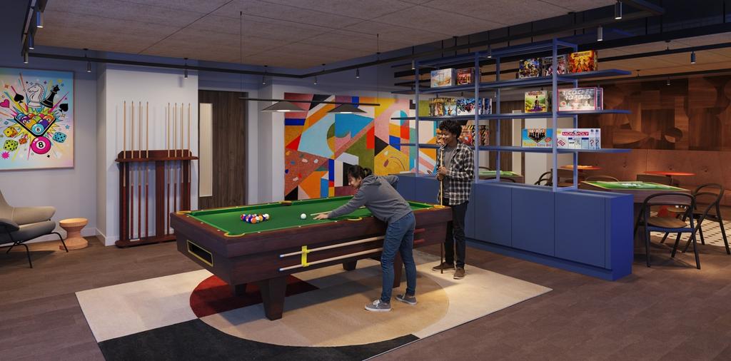 Bright, modern communal games lounge with a poo...