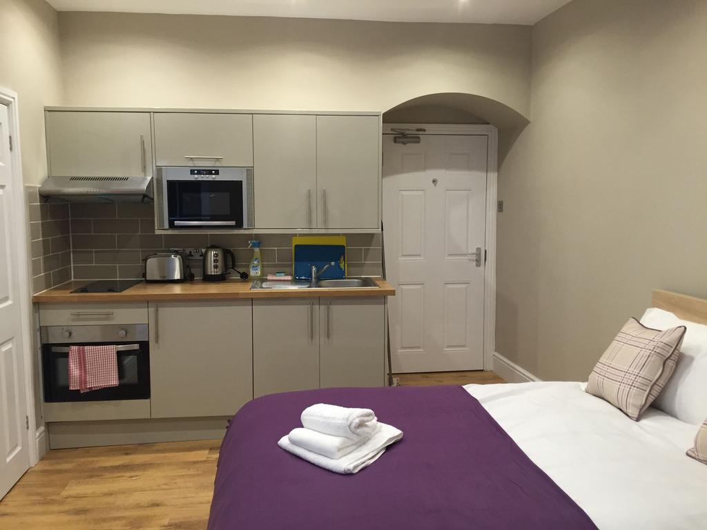 Bright, modern studio with integrated kitchenet...