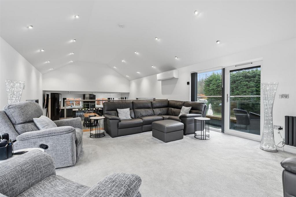 Upper lounge towards balcony and kitchen.jpg
