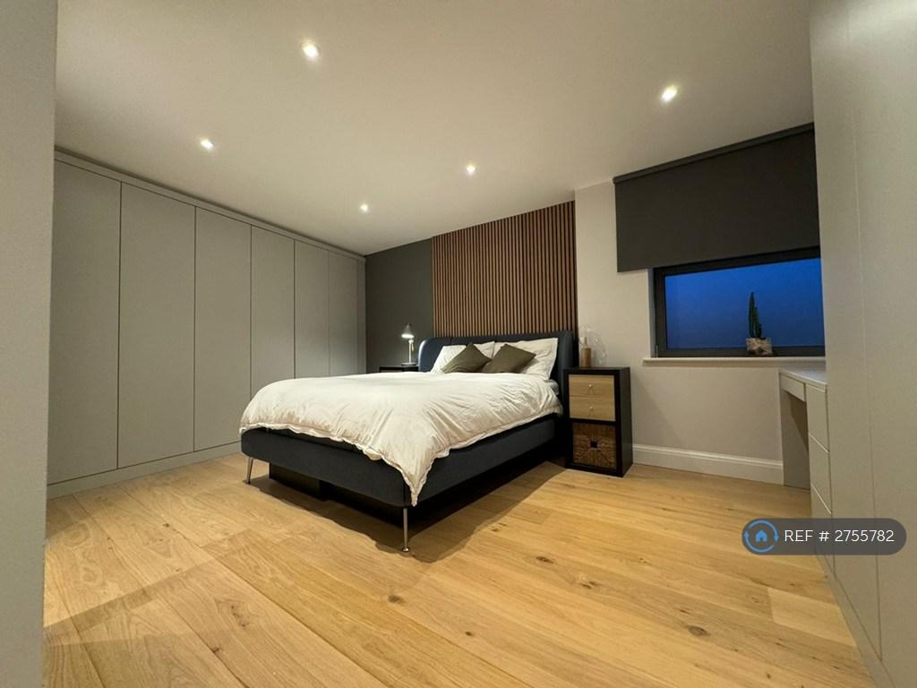 Main Ensuite Room With Wall-To-Wall Wardrobes