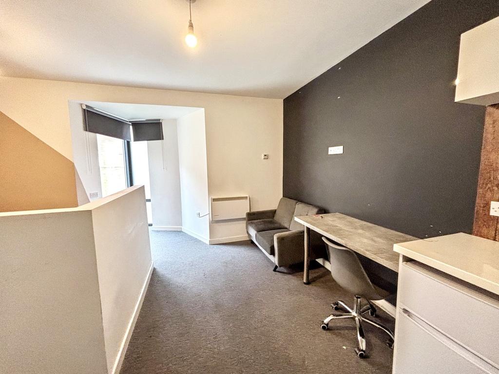 A spacious and well-maintained living room with...