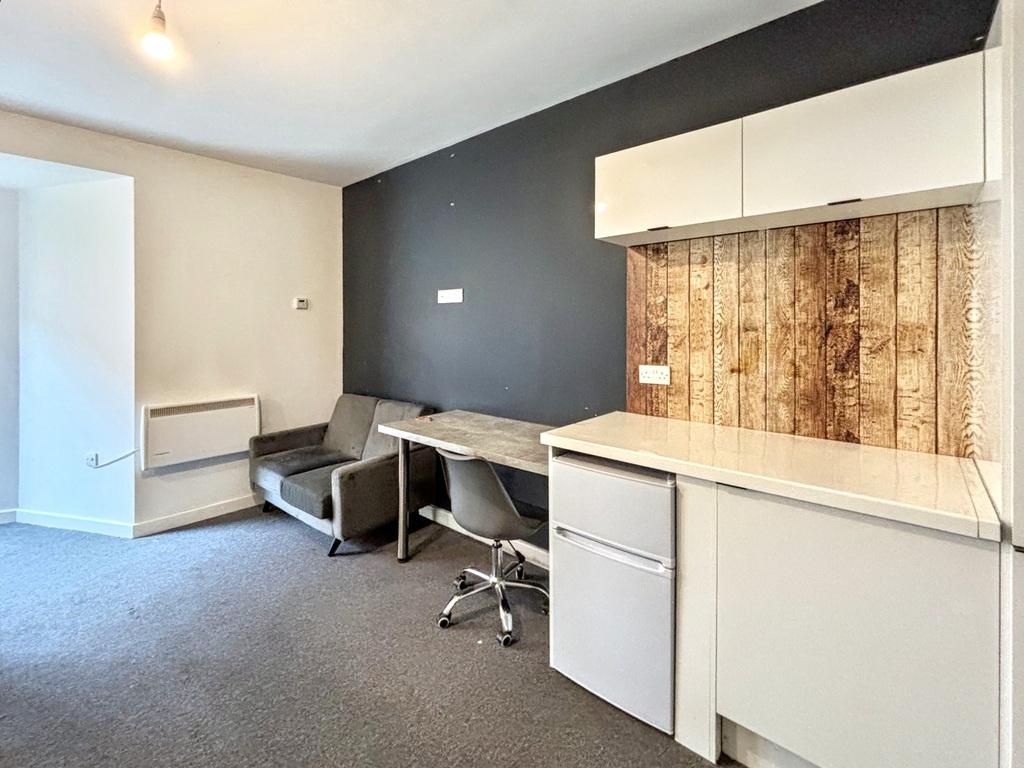 Bright, modern shared workspace with two built-...