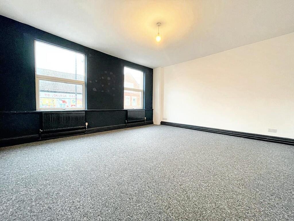 Bright, freshly decorated living room with two ...