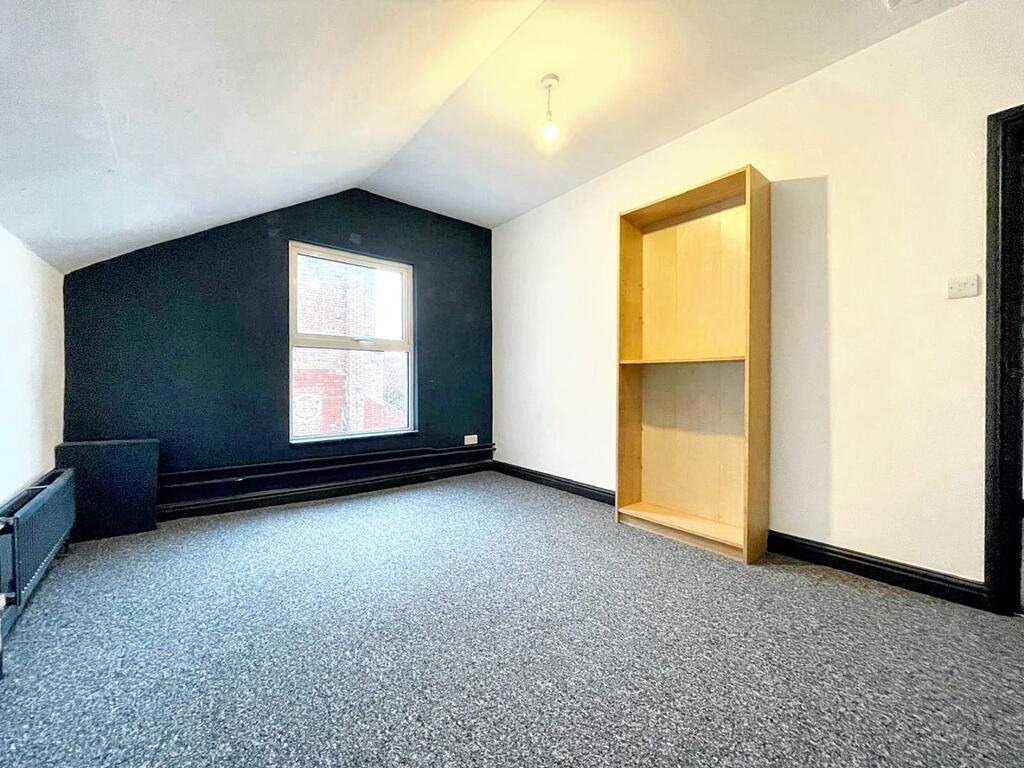 Bright, recently refreshed bedroom with a high,...