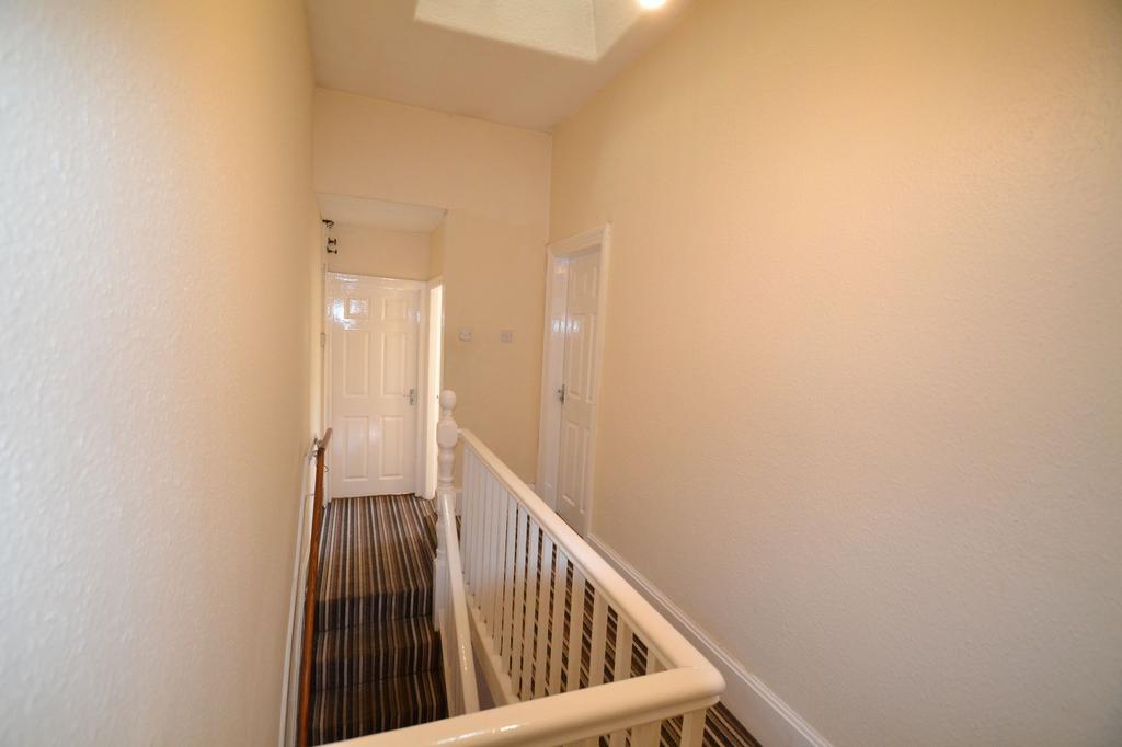 Bright, neutrally painted landing and stairwell...