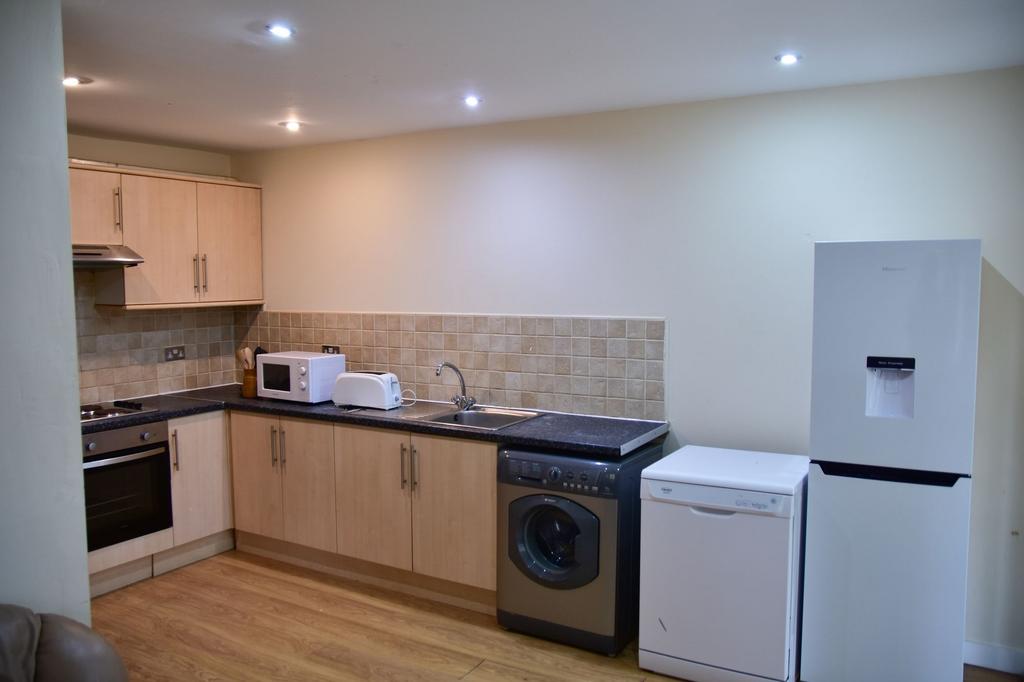 A modern, neatly maintained kitchen featuring w...