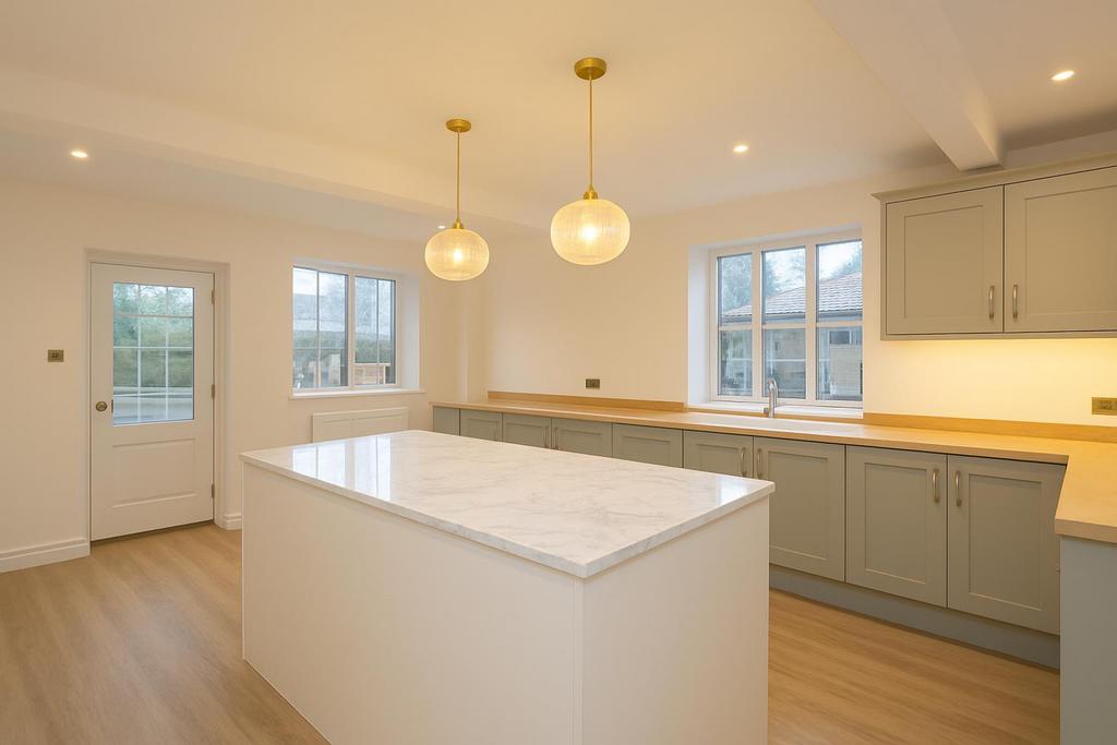 Spacious kitchen with marble island.png