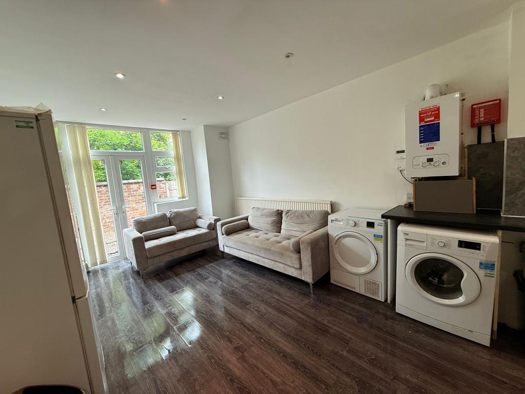 Bright open living area with large glazed doors...