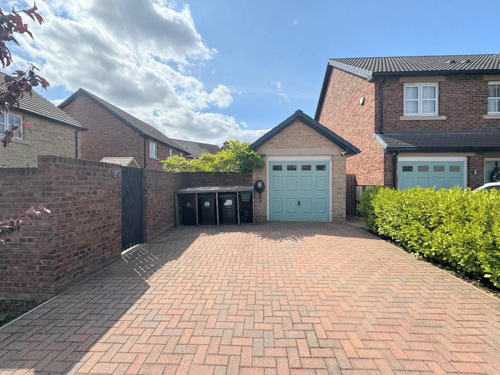 Garage and drive ( to the rear)