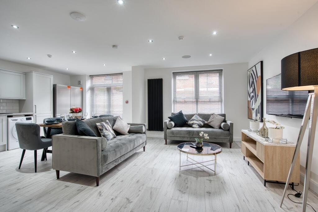 A bright and spacious contemporary living room ...
