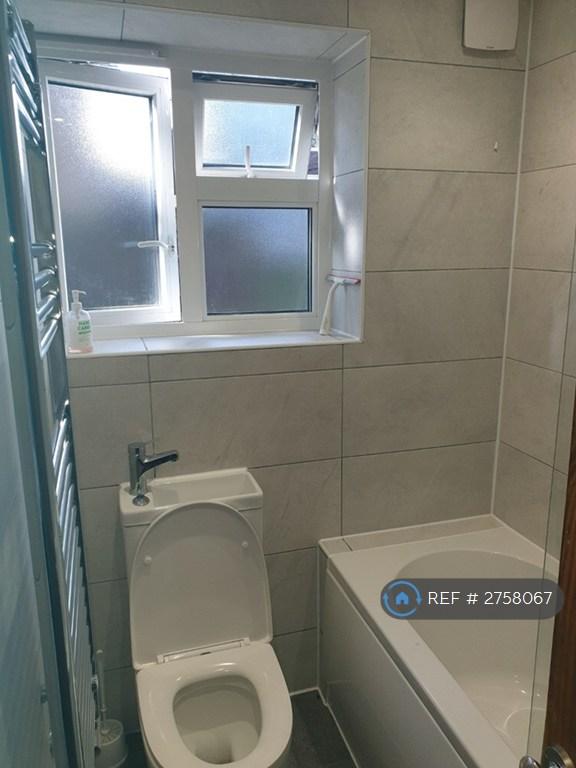 Bathroom With Bath And Toilet With Sink
