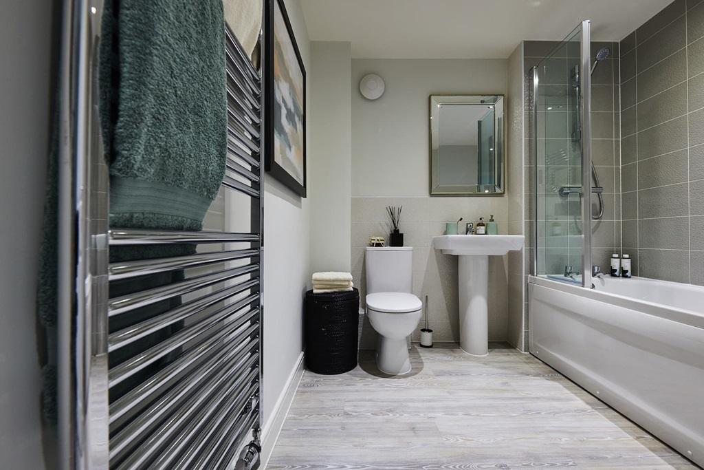Family bathroom with shower over bath