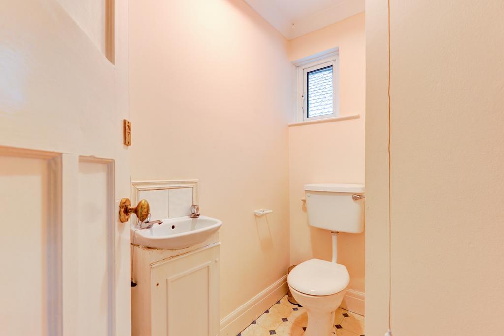 Compact and clean WC with a classic washbasin a...