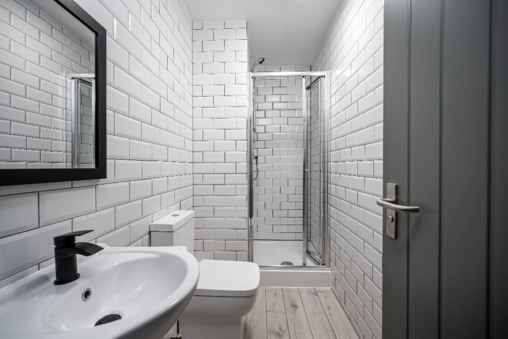 A modern and well-maintained bathroom with whit...