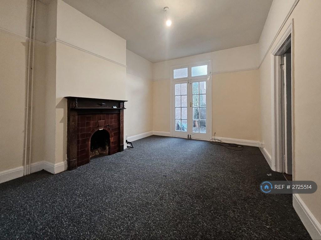 Living Rm With Doors To Kitchen And Yard