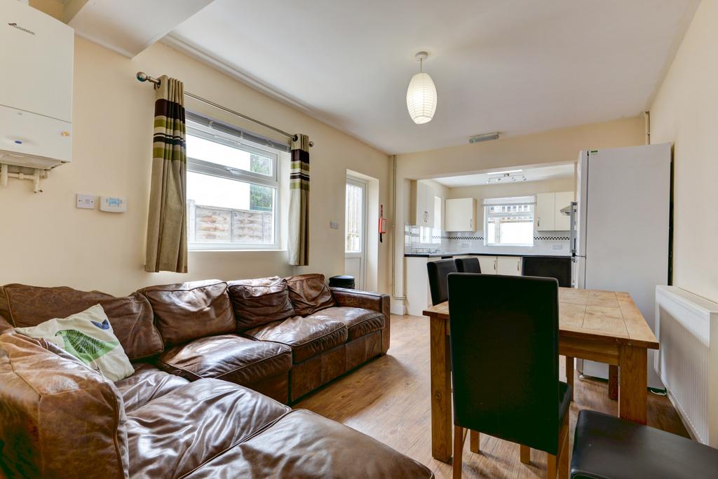 A bright and welcoming living room featuring a ...
