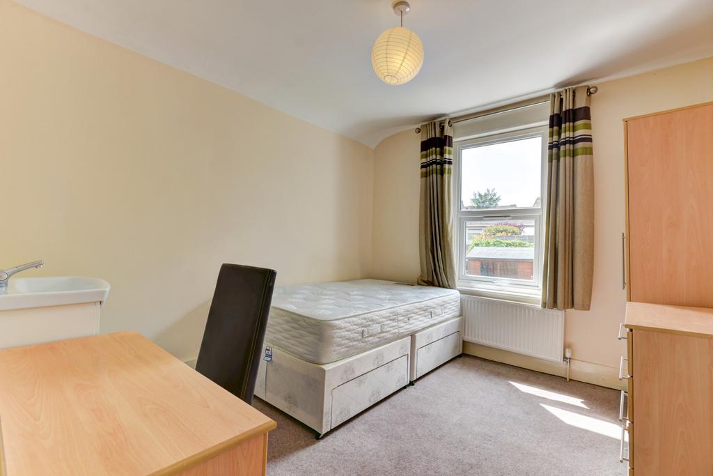 Bright, neatly presented bedroom with a double ...
