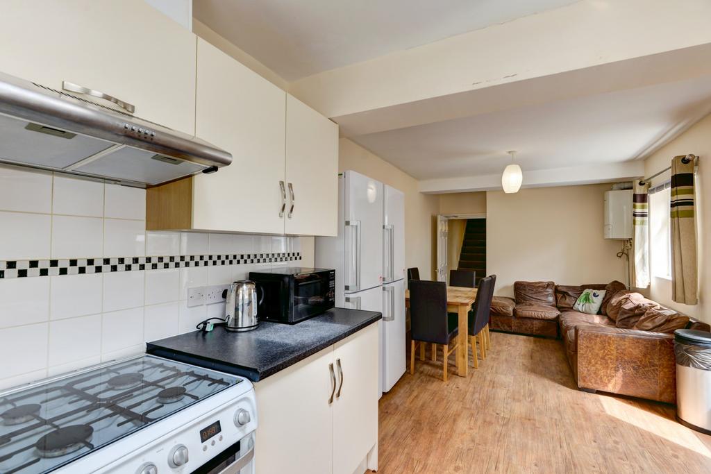 Open-plan kitchen and living area with fitted u...