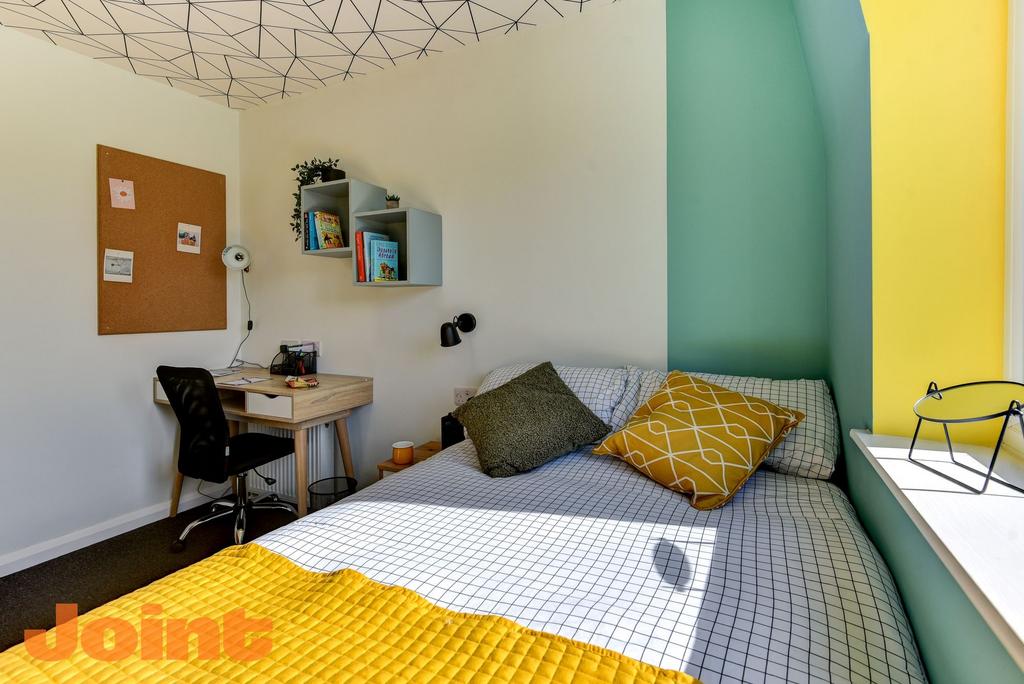Bright and inviting double bedroom featuring a ...