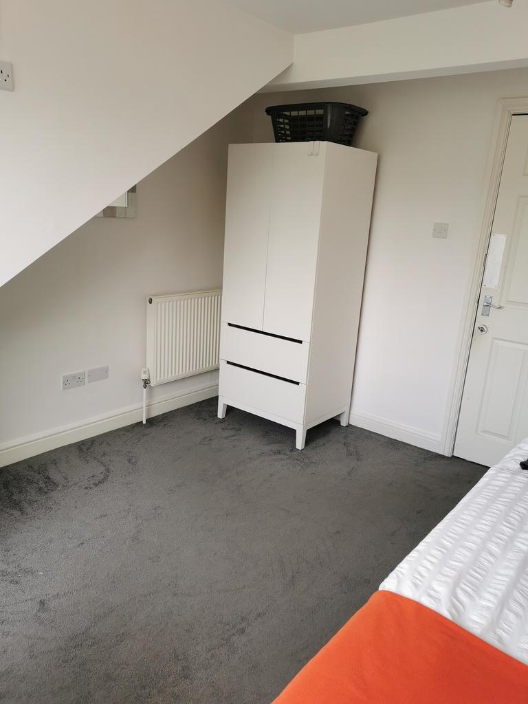 Bright, tidy bedroom with neutral décor, fitted...