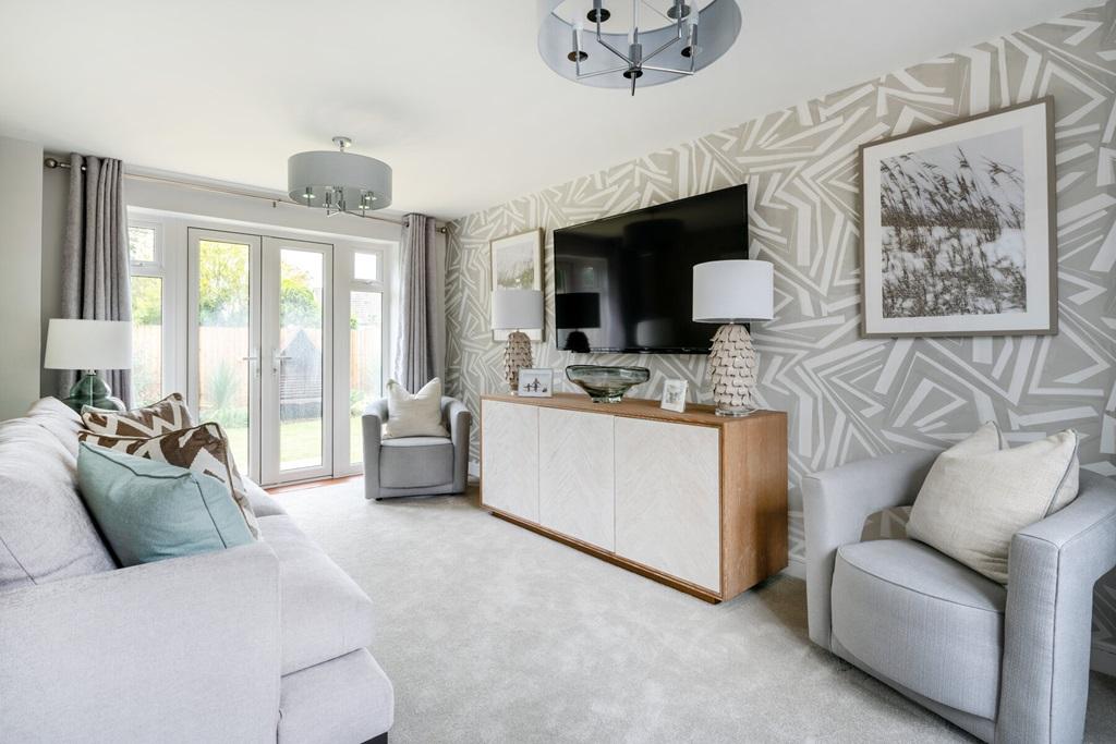 A bright and airy living room with French doors...