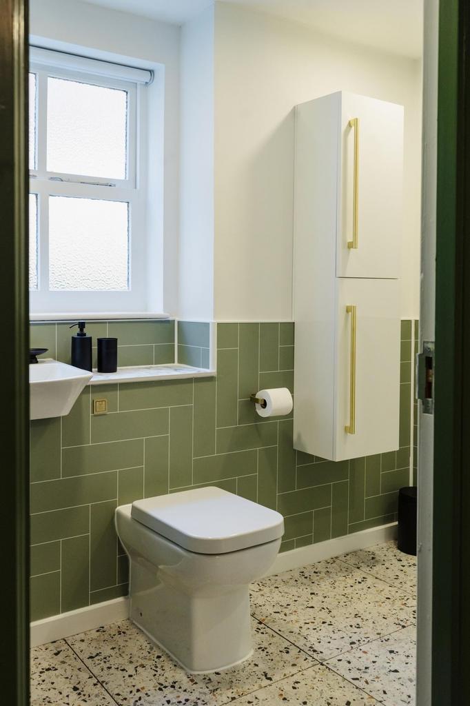 Bright and clean bathroom featuring a modern to...