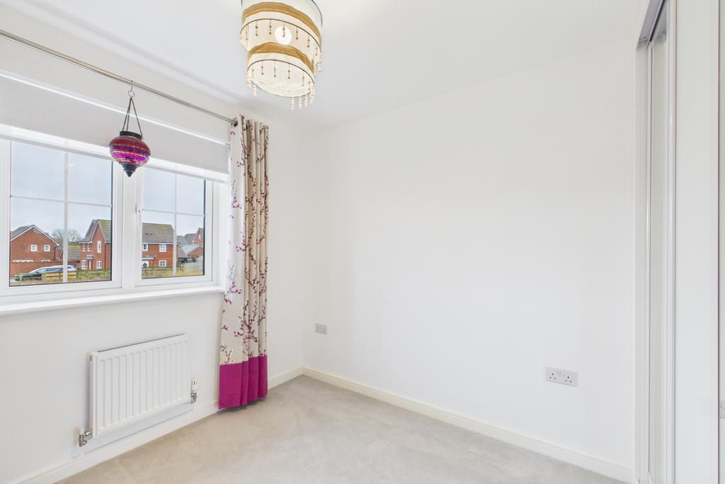 A double bedroom with view over the front open spa