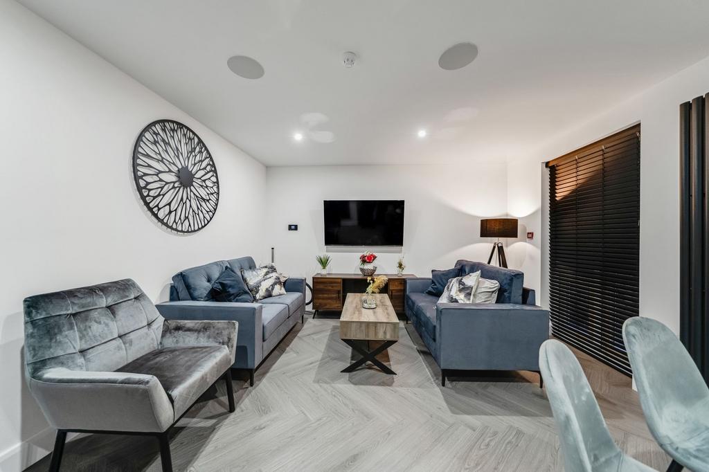 Modern and stylish living room featuring comfor...