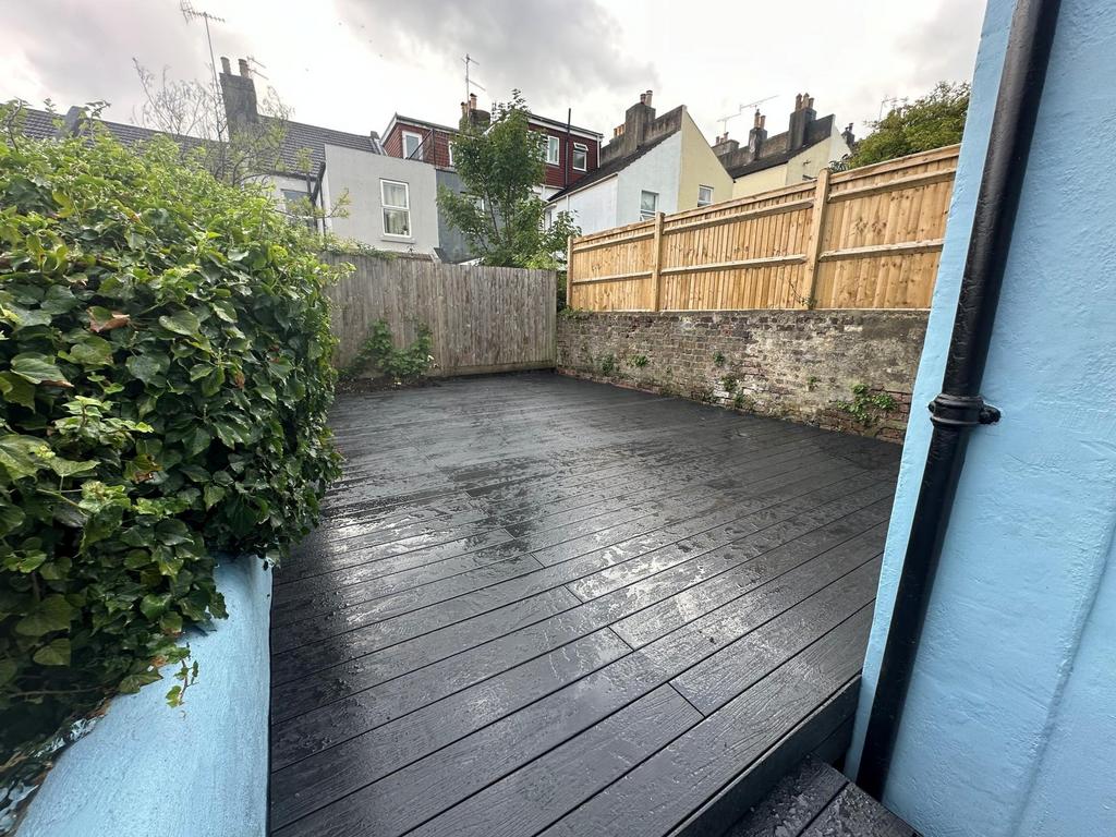 Low-maintenance private rear garden with timber...
